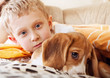 Closeup portrait boy with puppy