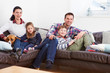 Family Relaxing Indoors Watching Television Together